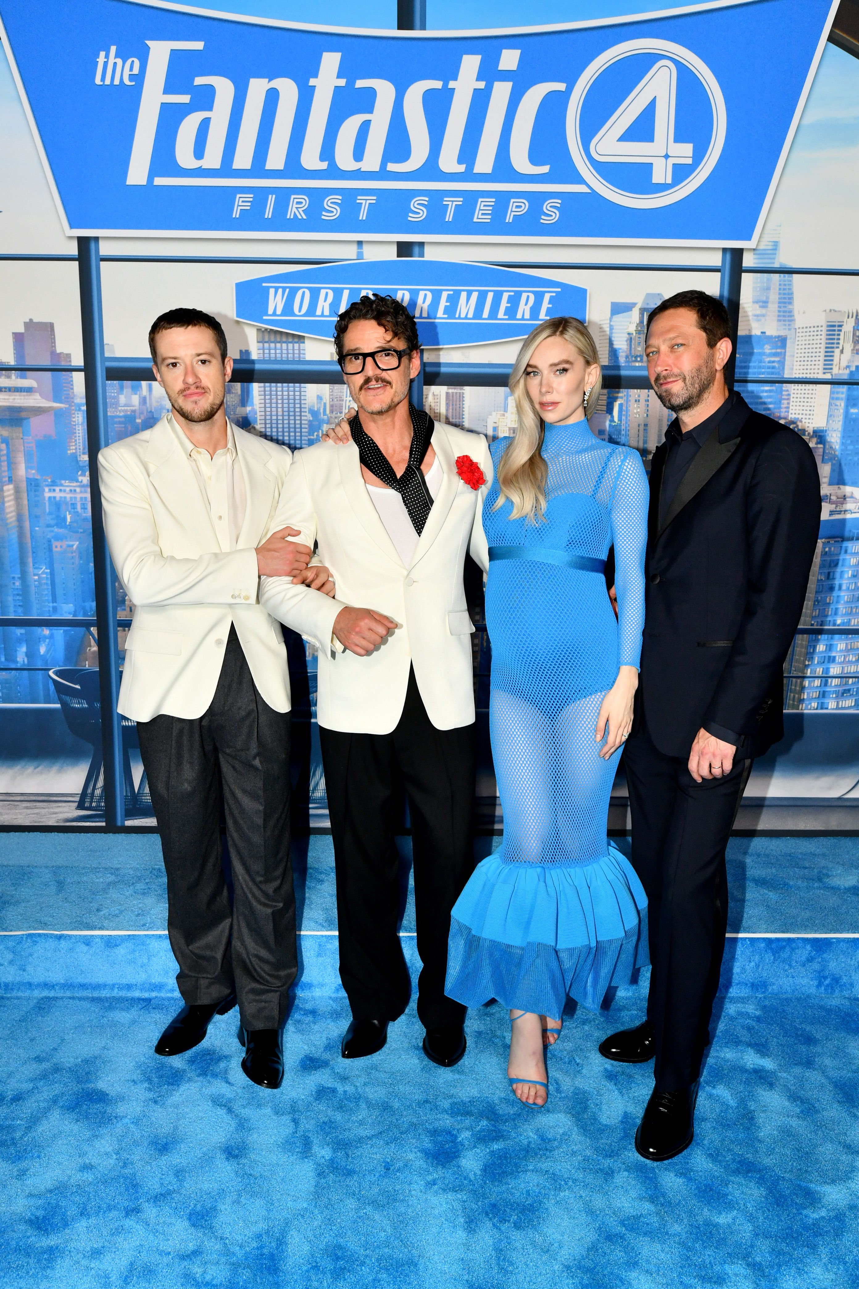 A cast photo of the main stars of The Fantastic Four: First Steps, including Pedro Pascal, Vanessa Kirby, Ebon Moss-Bachrach, and Joseph Quinn, smiling for the camera.